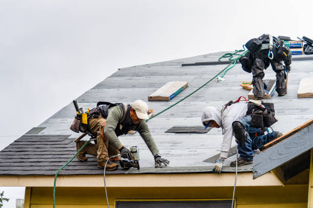 Professional Roof Replacement technician working in Saxton, PA